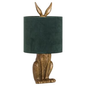 The Antique Gold Hare Table Lamp with Green Velvet Shade is a charming and elegant lighting piece, perfect for adding a touch of sophistication and character to any interior. Featuring an intricately detailed antique gold hare base, this lamp is both a statement piece and a functional lighting solution. Topped with a luxurious green velvet shade, the lamp emits a soft, warm glow, making it ideal for bedrooms, living spaces, or cosy reading nooks. The rich colour palette and whimsical design ensure this piece stands out while blending beautifully with classic, vintage, and contemporary décor. Perfect for those who love unique and artistic home accessories, the Antique Gold Hare Table Lamp adds a touch of luxury and charm to any setting.