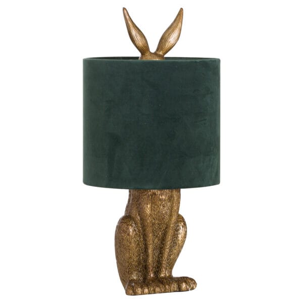 The Antique Gold Hare Table Lamp with Green Velvet Shade is a charming and elegant lighting piece, perfect for adding a touch of sophistication and character to any interior. Featuring an intricately detailed antique gold hare base, this lamp is both a statement piece and a functional lighting solution. Topped with a luxurious green velvet shade, the lamp emits a soft, warm glow, making it ideal for bedrooms, living spaces, or cosy reading nooks. The rich colour palette and whimsical design ensure this piece stands out while blending beautifully with classic, vintage, and contemporary décor. Perfect for those who love unique and artistic home accessories, the Antique Gold Hare Table Lamp adds a touch of luxury and charm to any setting.