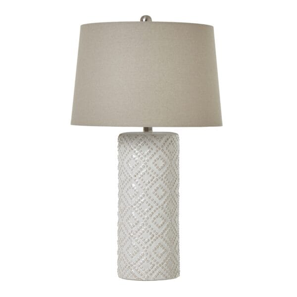 Topped with a neutral linen lampshade, the White Beaded Ceramic Lamp diffuses a soft and ambient glow, creating a warm and inviting atmosphere in living rooms, bedrooms, or hallway consoles. Its understated elegance and high-quality craftsmanship ensure it blends seamlessly into any refined space, adding depth, warmth, and a natural element.