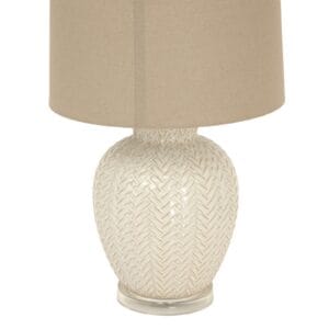 Topped with a neutral linen lampshade, the Twill Weave Ceramic Lamp diffuses a soft, ambient glow, creating a warm and inviting atmosphere in living rooms, bedrooms, or stylish office spaces. The delicate detailing and high-quality craftsmanship ensure it seamlessly blends into any refined space, adding depth, warmth, and a tactile element.