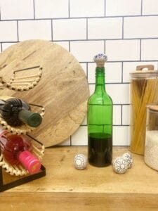 Set of 12 assorted bottle stops featuring hand-painted ceramic and cork detailing for stylish wine sealing