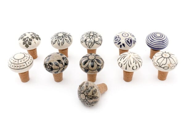 Set of 12 assorted bottle stops featuring hand-painted ceramic and cork detailing for stylish wine sealing