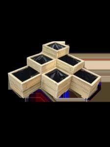 Tiered L-shaped wooden garden planter with square compartments, placed on concrete patio